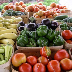 Baskets of fresh fruits and vegetables available at the Salt Air Farmers' Market.