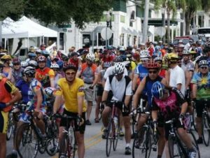 Cyclists pedaling down the streets in the Mount Dora Bicycle Festival in Florida.